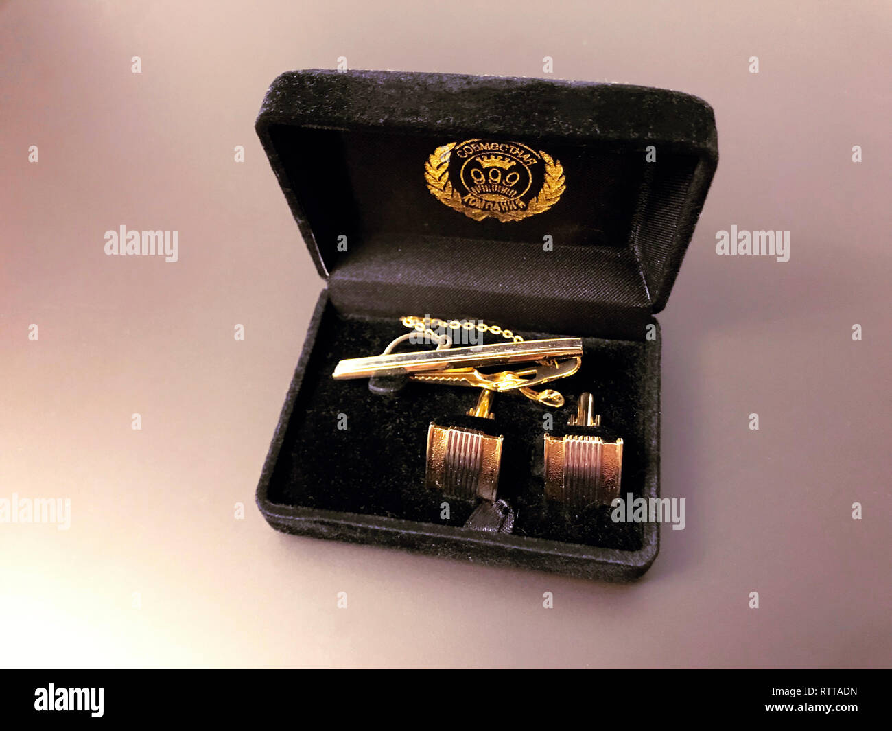 elegant male silver cufflinks in a black box on gray background Stock Photo