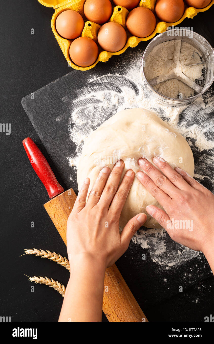 Food preparation concept over head shot Kneading dough for bakery