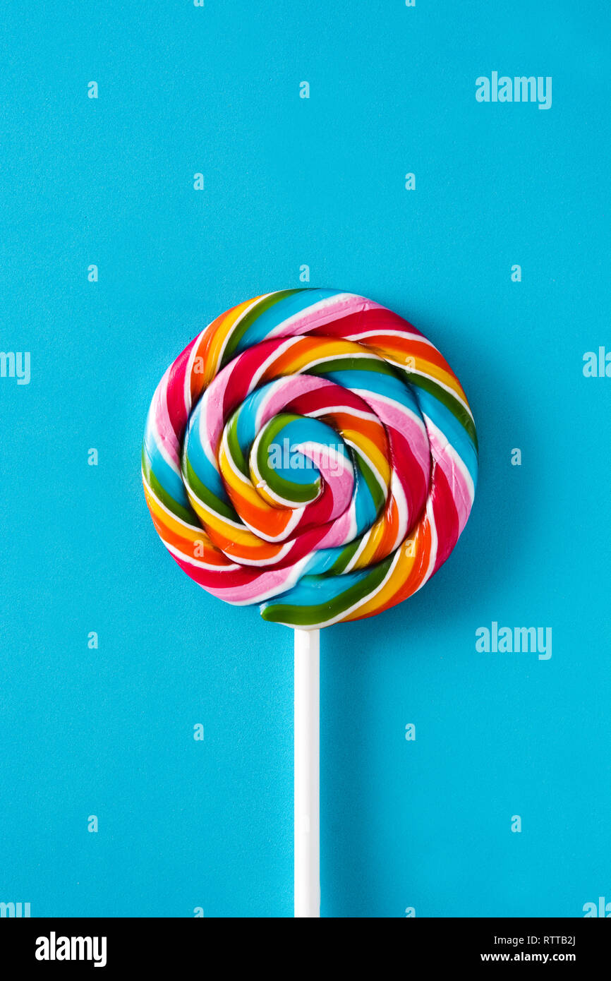 Colorful lollipop on blue background. Top view. Stock Photo