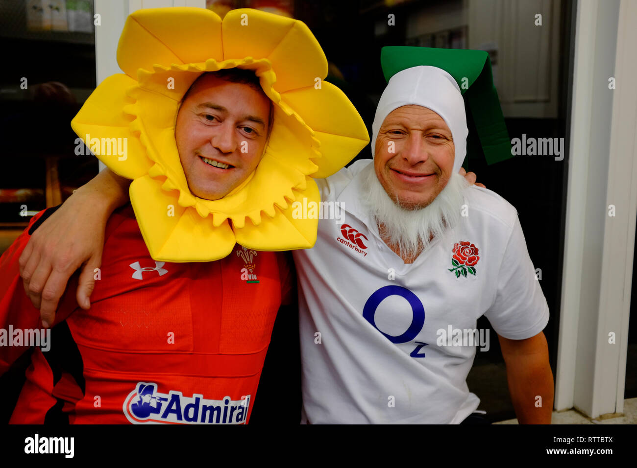 England,Wales,Rugby,supporters,in,takeaway, kebab,shop, dressed,as,daffodil, fancy,dress, Stock Photo
