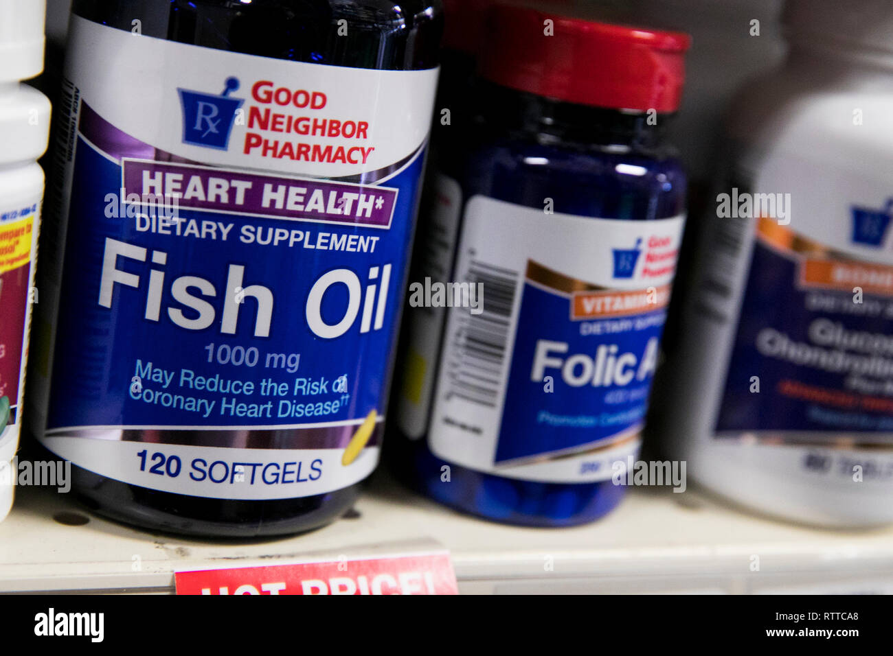 Bottles of Fish Oil supplements photographed in a pharmacy. Stock Photo