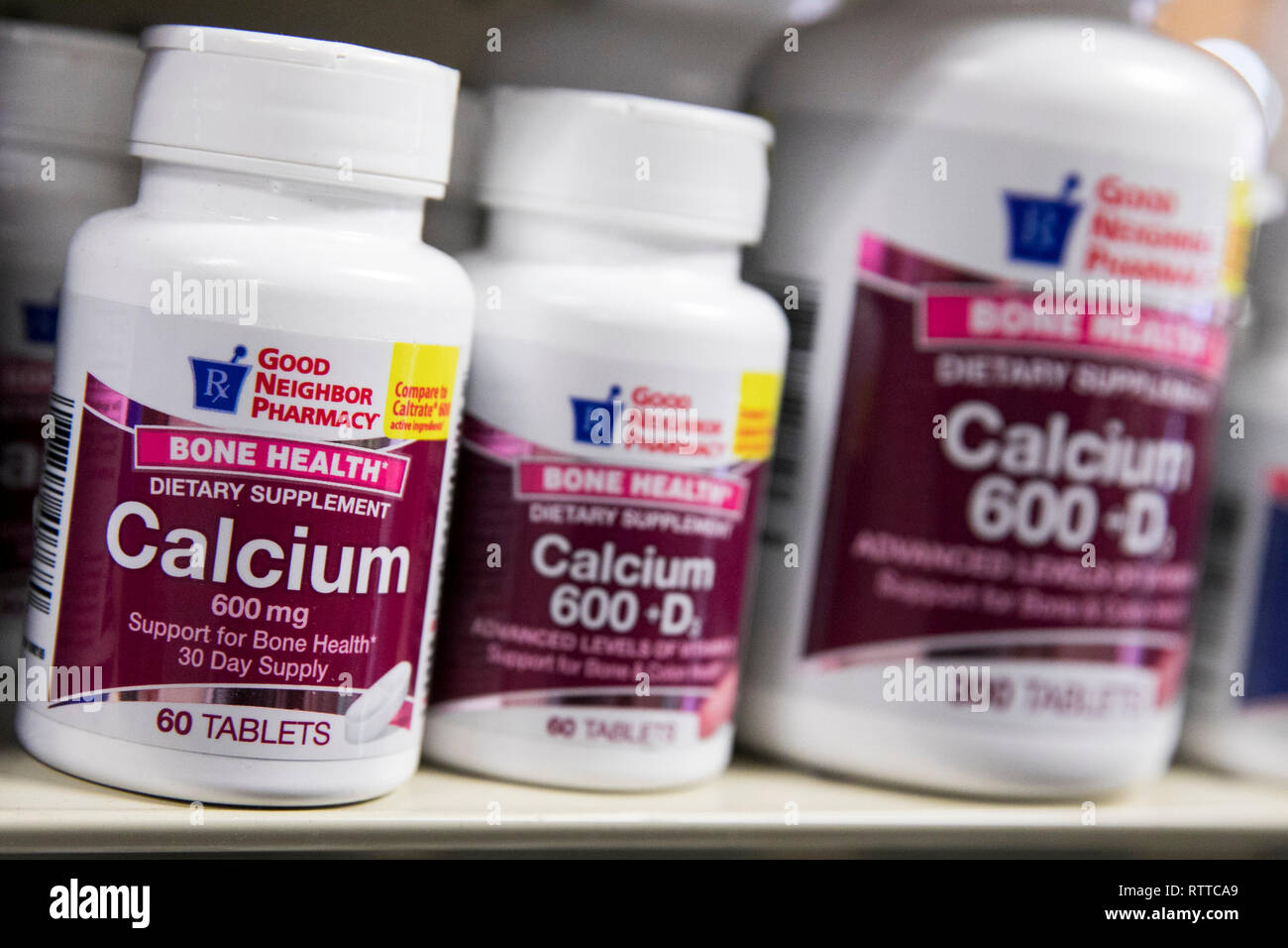 Bottles of Calcium supplements photographed in a pharmacy. Stock Photo