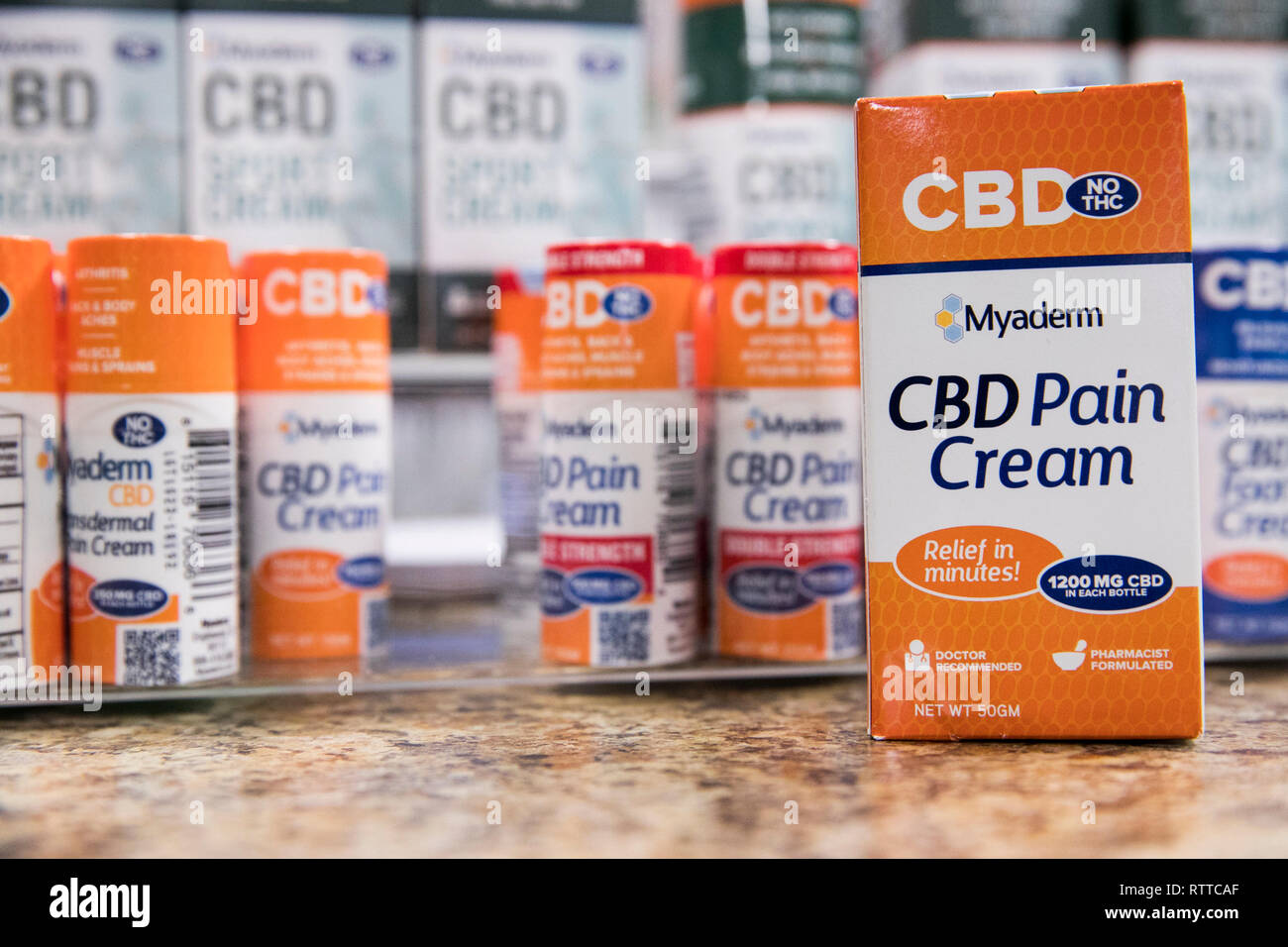 Bottles of Myaderm CBD (Cannabidiol) pain cream treatment products