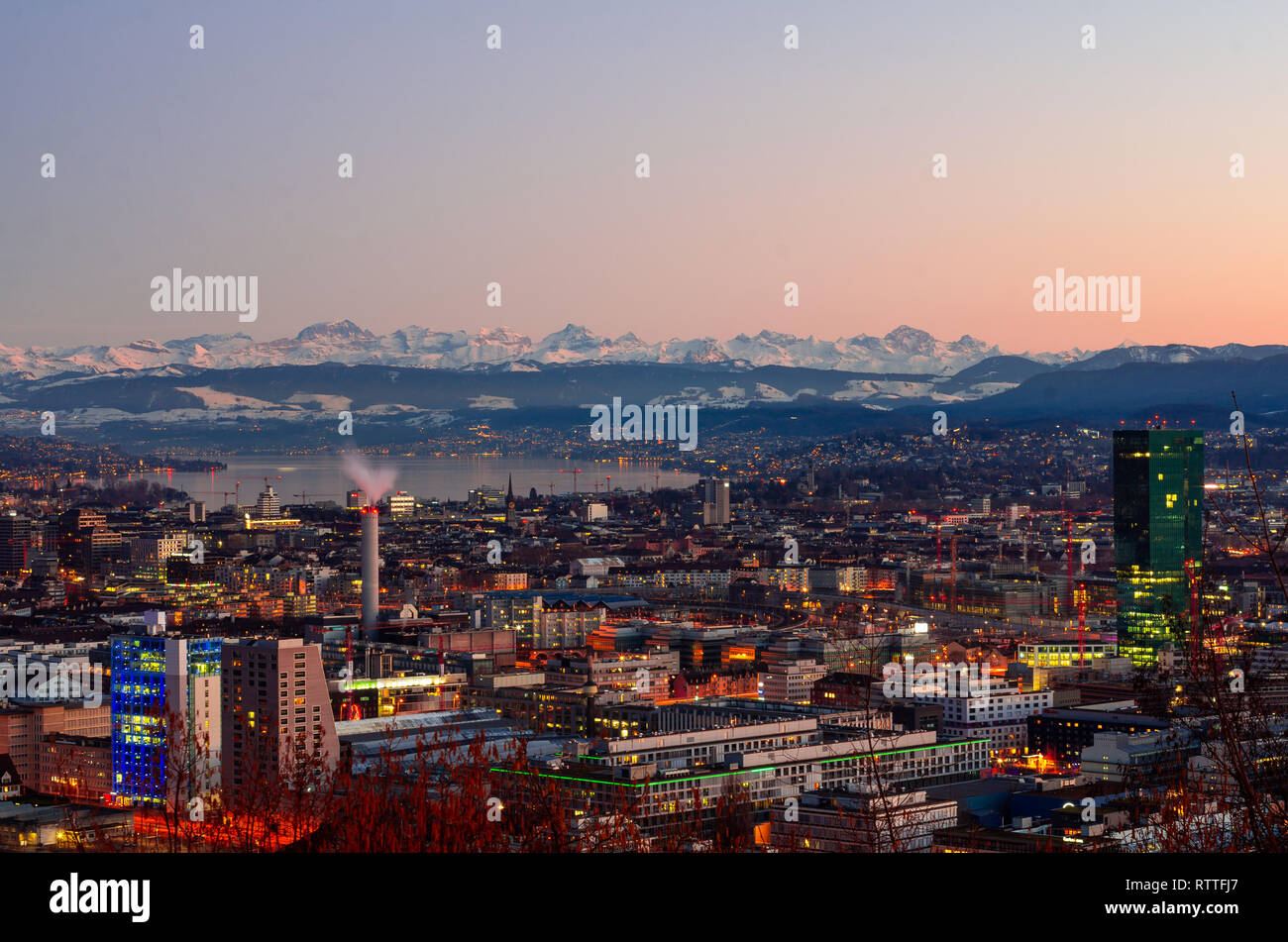 Zurich city overlook at sunset, alps in the background Stock Photo