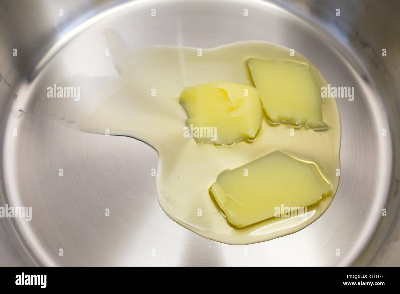 Buttered lard heating and melting in a cooking pot Stock Photo Alamy