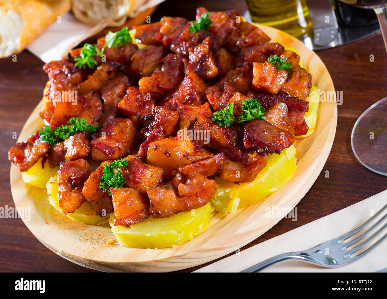 Morro de cerdo a la gallega spanish dish. Roast nose and cheek pigs with parsley and potatoes