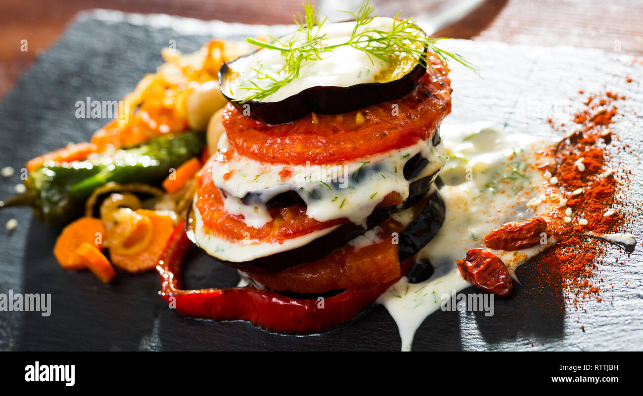 Fried eggplant and tomato pyramid with garlic yoghurt sauce Stock Photo Alamy