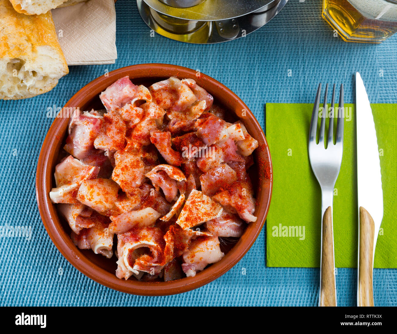 Top view of traditional spanish tapa Orejas de cerdo braised pig ears