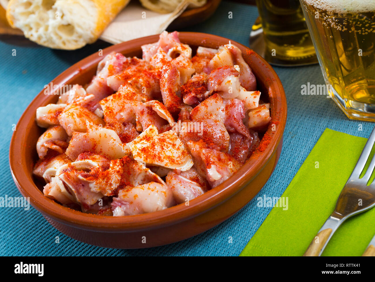 Spanish tapas pig ears with paprika served in bowl Stock Photo Alamy