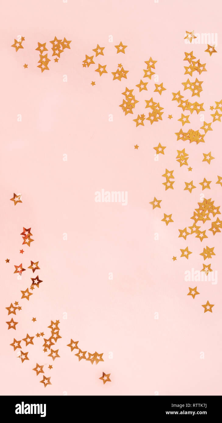 Pink background with stars, copy space. Golden stars confetti on pastel ...