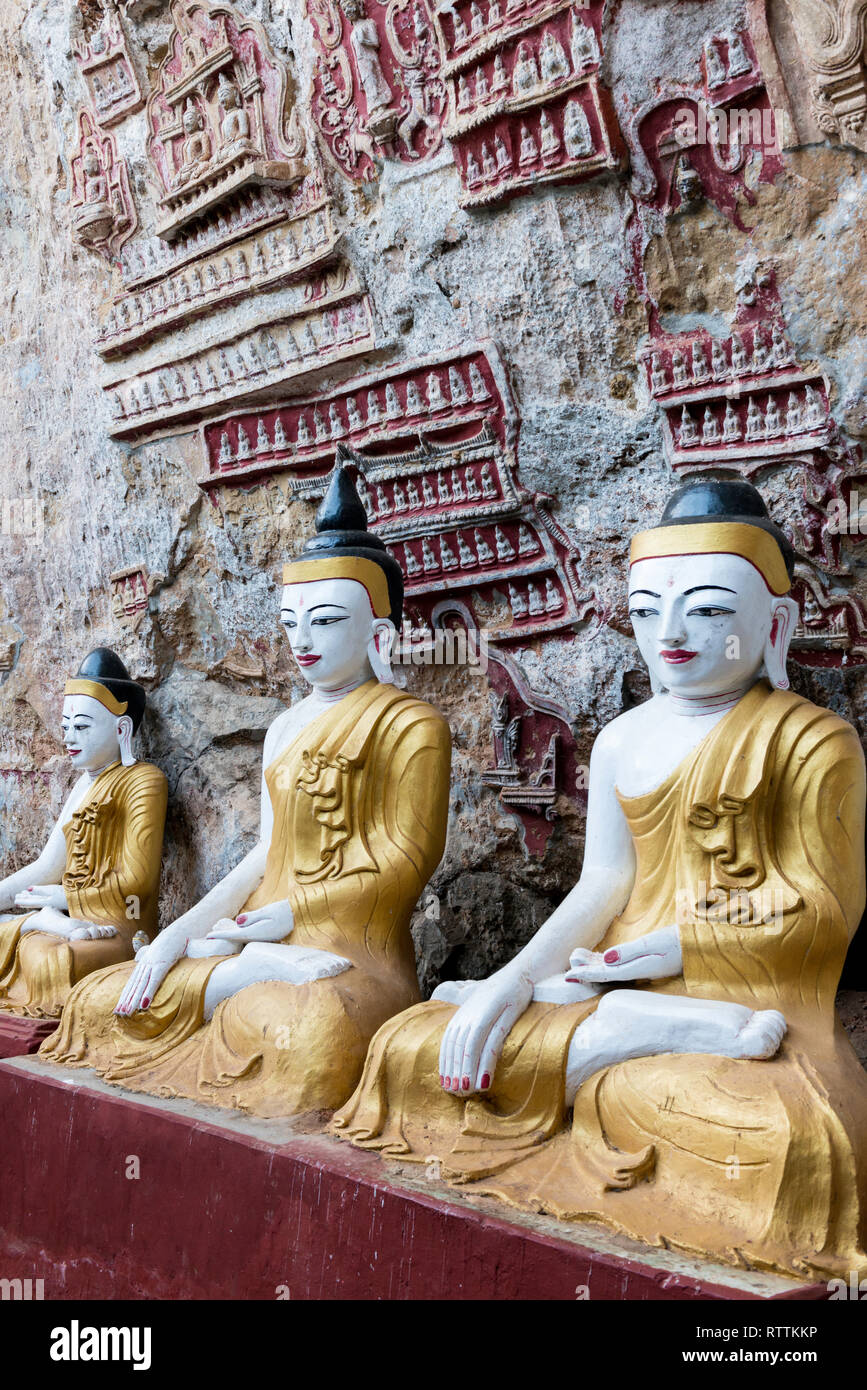 HPA-AN, MYANMAR - 19 NOVEMBER, 2018: Vertical picture of amazing Buddha statues with decorated walls at Kaw Goon Cave in Hpa-An, Myanmar Stock Photo