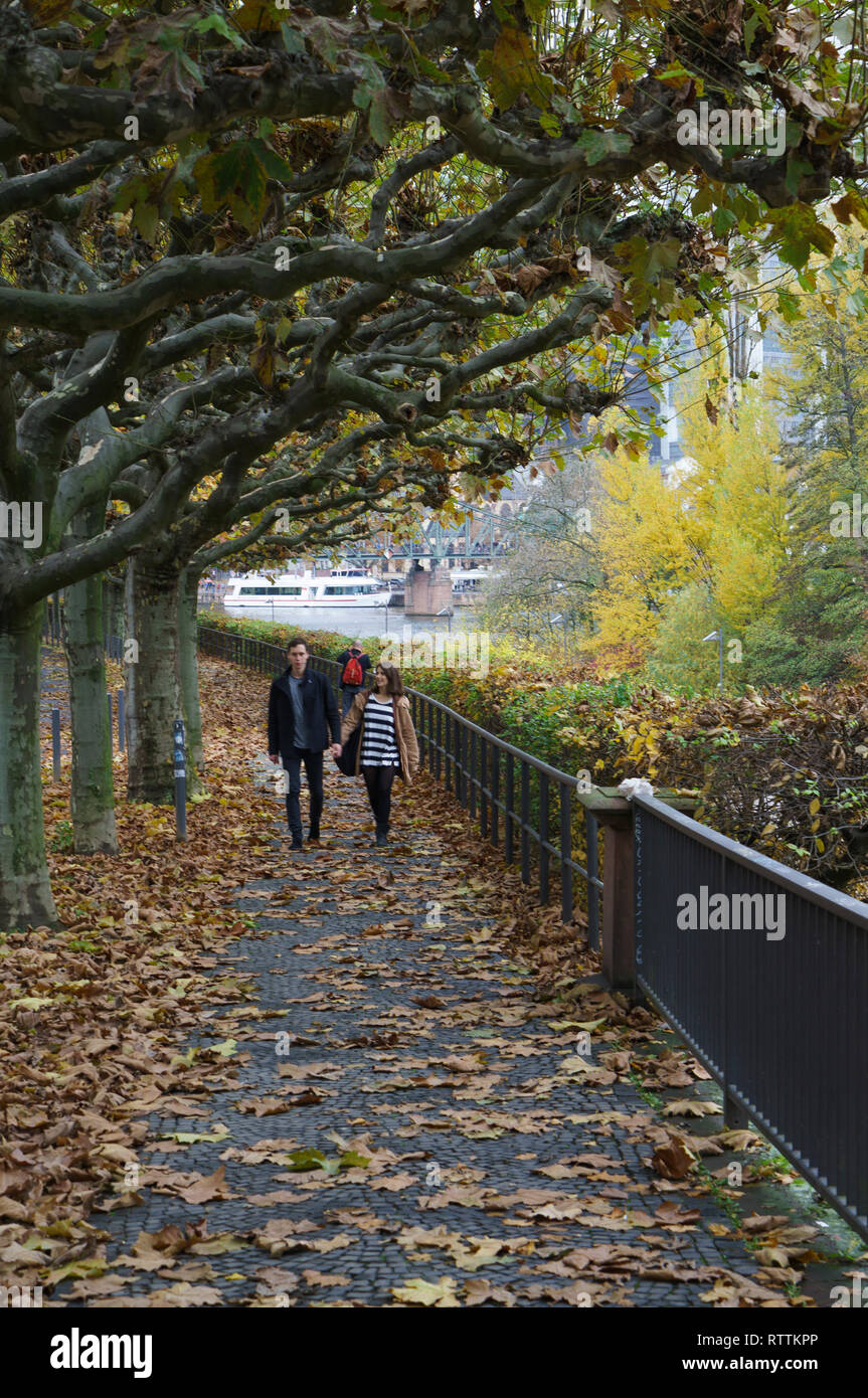 Couple on riverside railing hi-res stock photography and images - Alamy