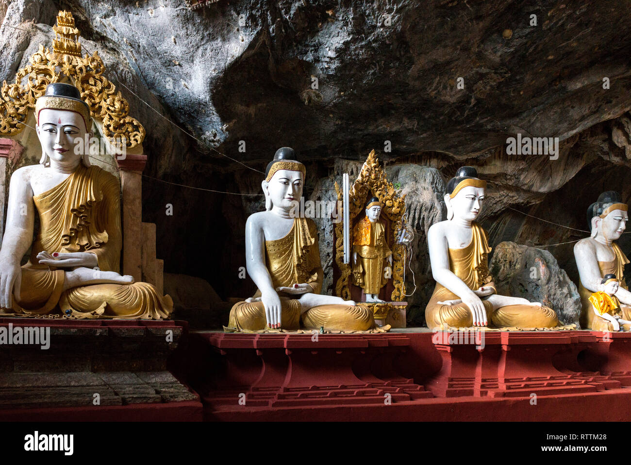 HPA-AN, MYANMAR - 19 NOVEMBER, 2018: Horizontal picture of Buddha statues in the interior of Kaw Goon Cave, landmark of Hpa-An, Myanmar Stock Photo