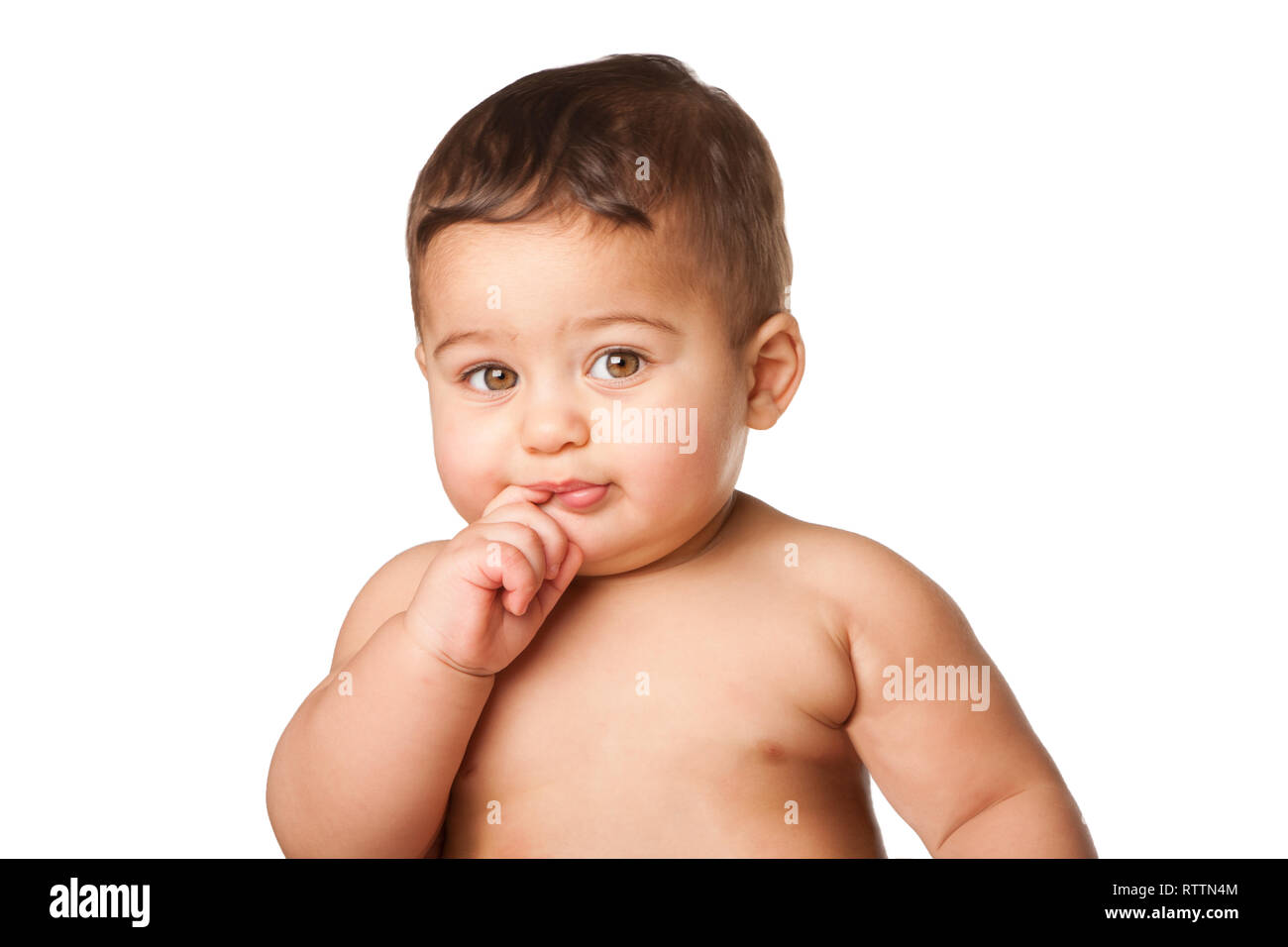 Cute happy innocent baby infant face with big light green eyes and finger in mouth, childhood concept, on white. Stock Photo