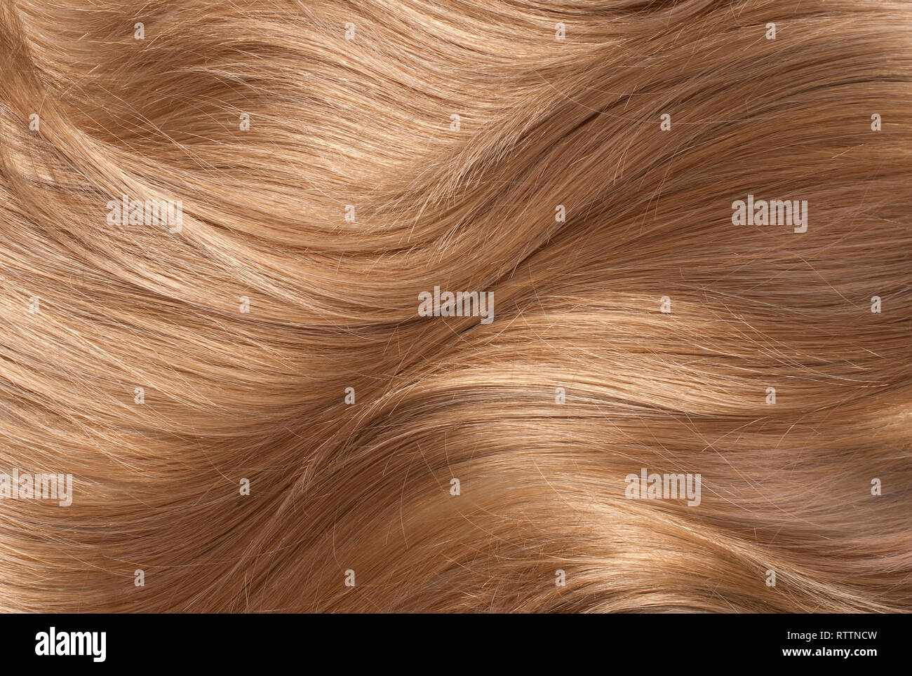Wavy blonde human hair background Stock Photo