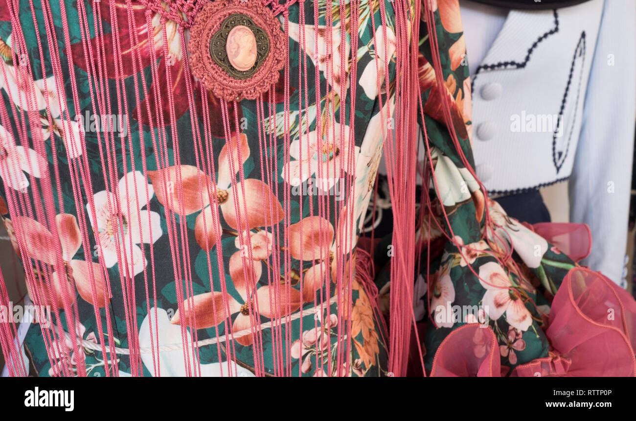 Spanish dress with fringed shawl & brooch Stock Photo