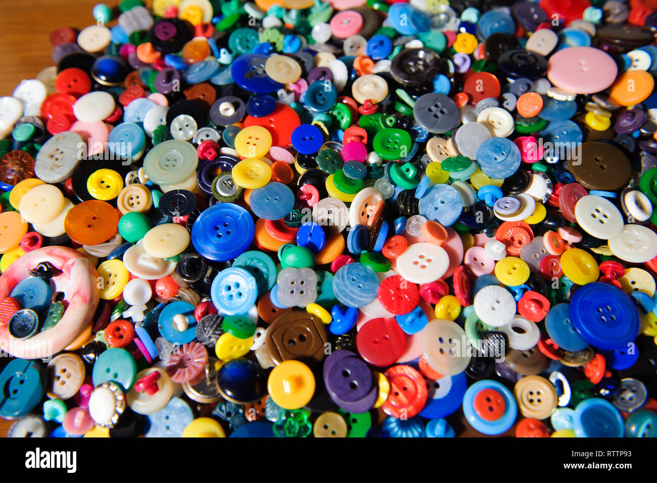 Lot of colorful plastic clothing buttons. Many small round vintage ...