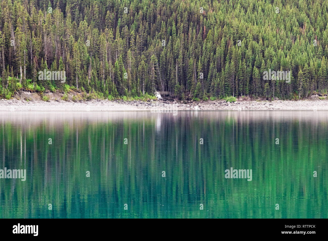 Reflections in the Upper Kananskis Lake - Rocky Mountains, Alberta, Canada Stock Photo