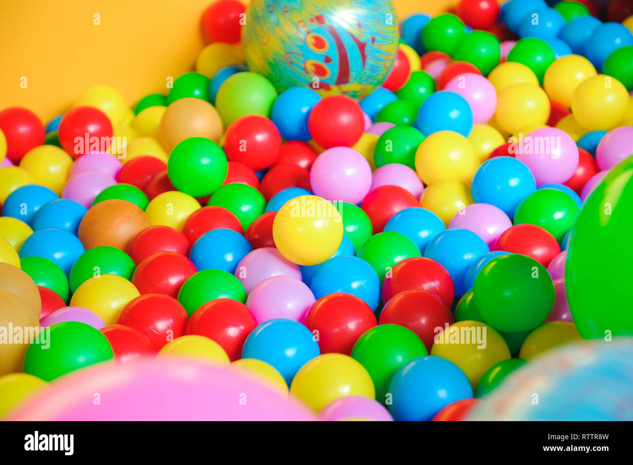 Indoor playground with colorful plastic balls for children Stock Photo