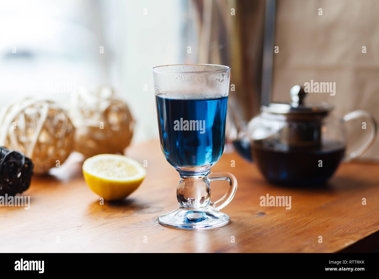 Blue Anchan tea in an Irish glass. Butterfly pea Cup tea, flowers, peas
