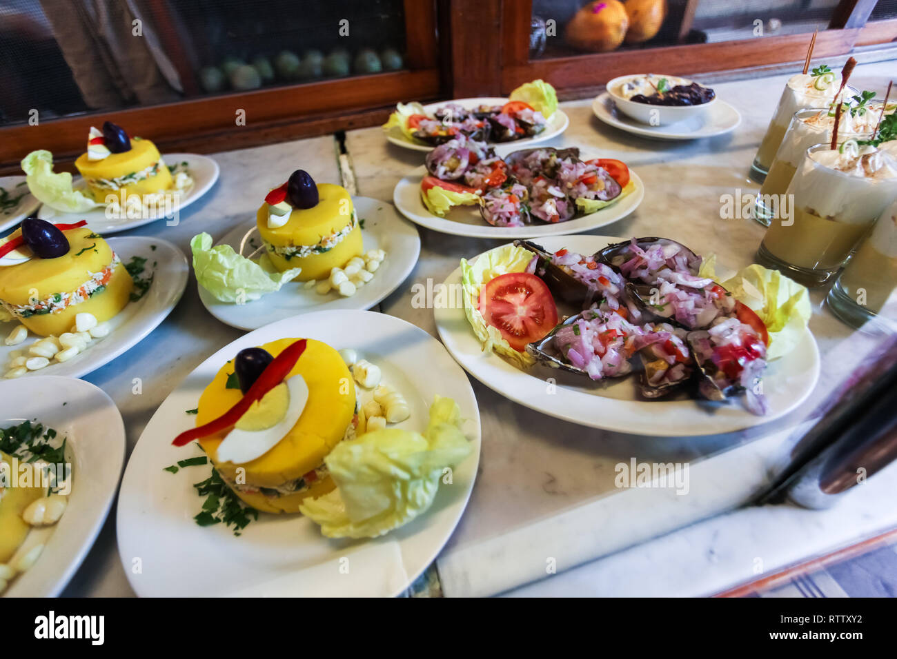 Typical dishes of Peruvian cuisine, made with potatoes, fish, eggs, shells Stock Photo
