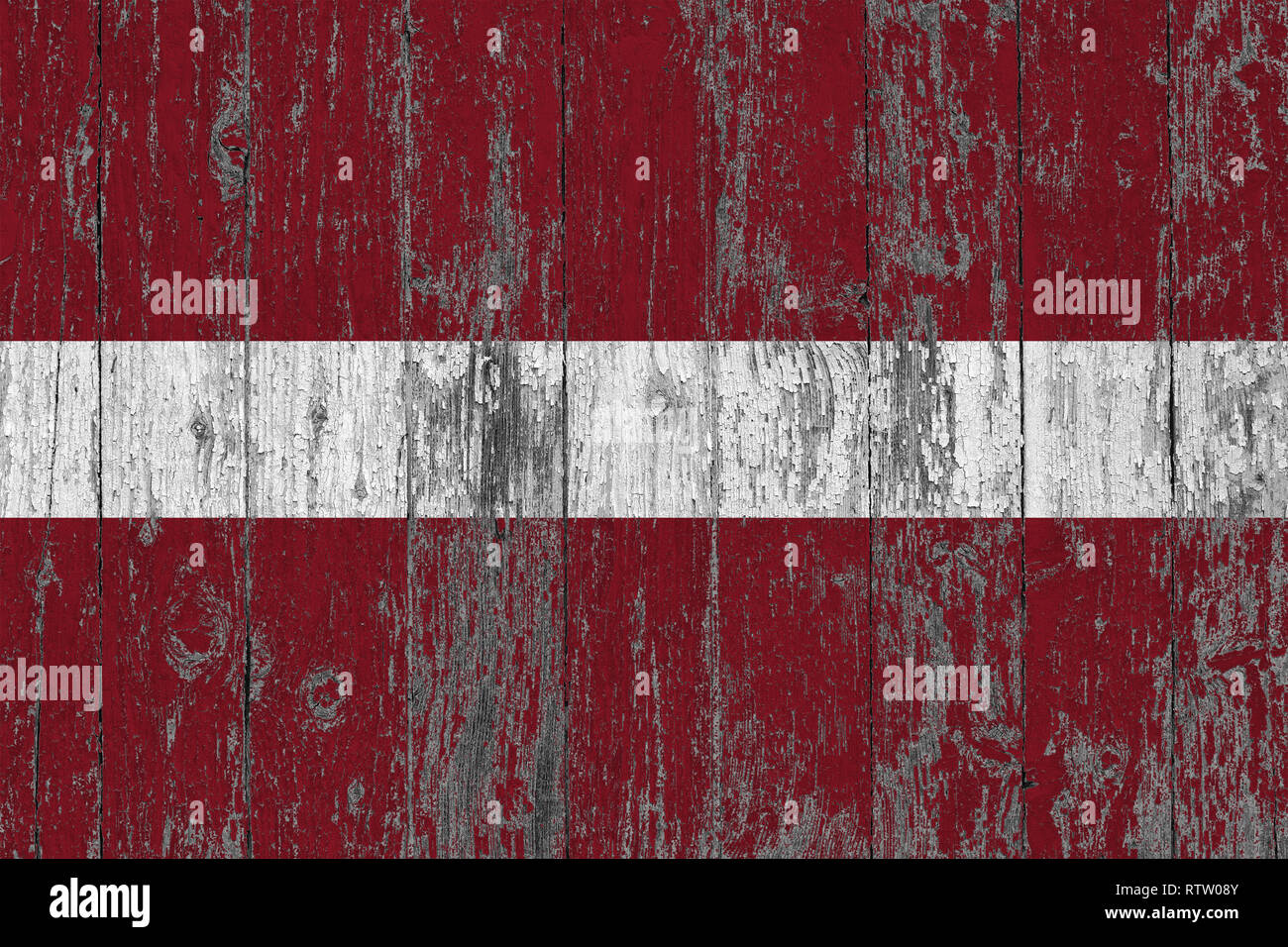 Flag of Latvia painted on worn out wooden texture background Stock ...
