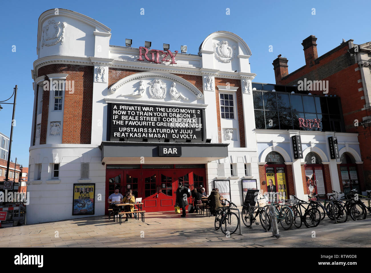 Ritzy Cinema and Bar outside view showing movies films in Brixton street scene South London UK  KATHY DEWITT Stock Photo