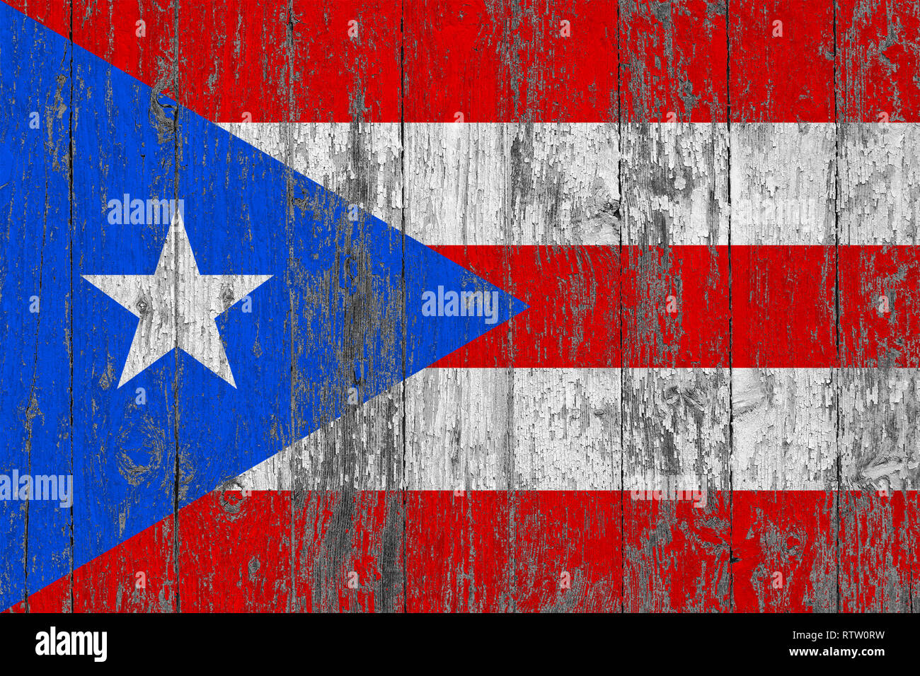 Flag of Puerto Rico painted on worn out wooden texture background Stock ...