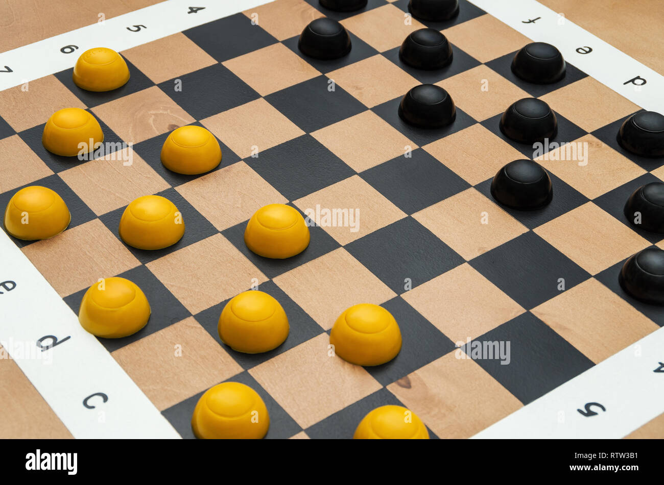 A chessboard with figures in a public park designed for playing chess or checkers Stock Photo