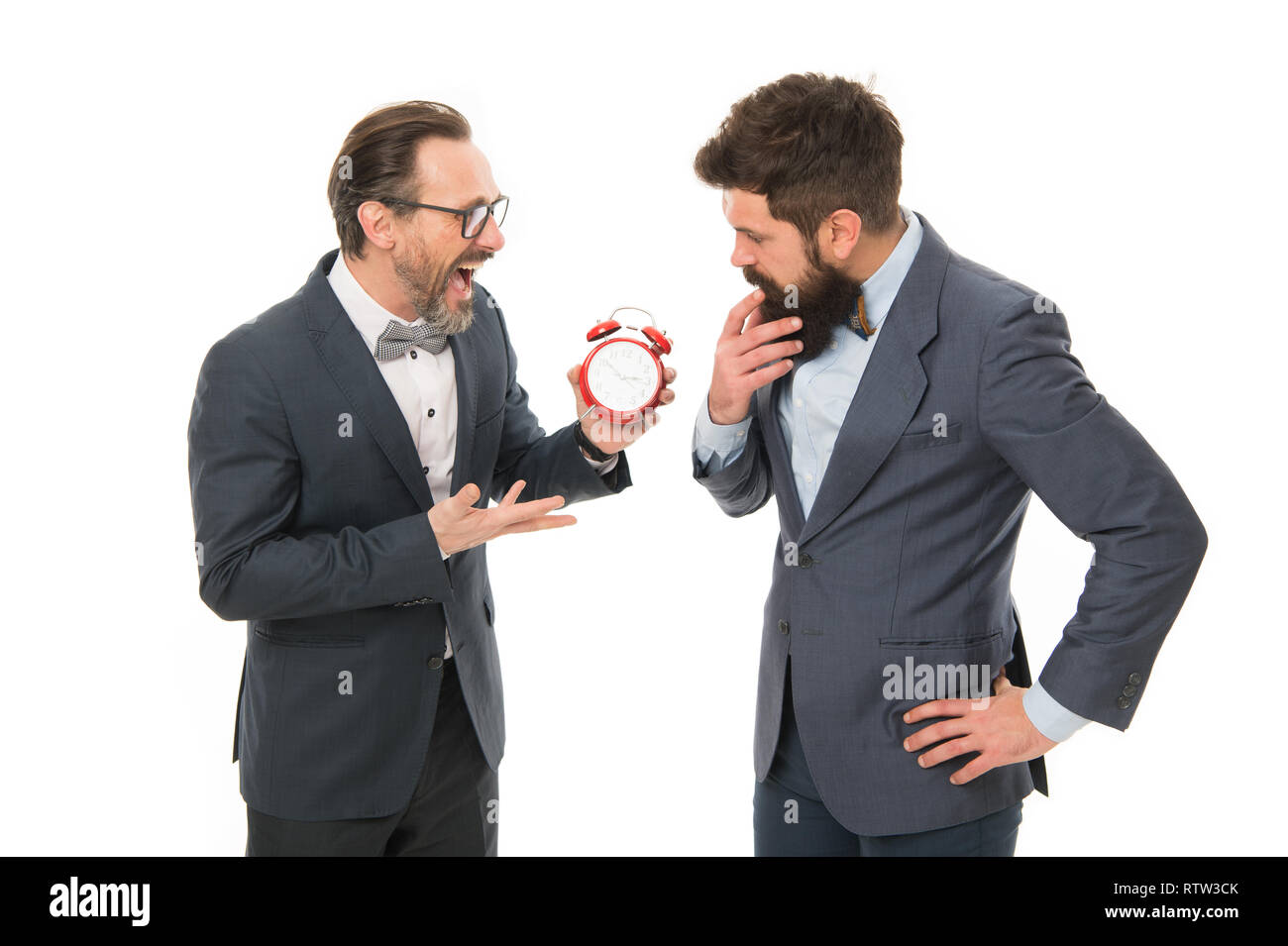 Encourage discipline. Business people formal clothes having different opinion about time. Time management and discipline. Improve punctuality. Man experienced with clock care about time efficiency. Stock Photo