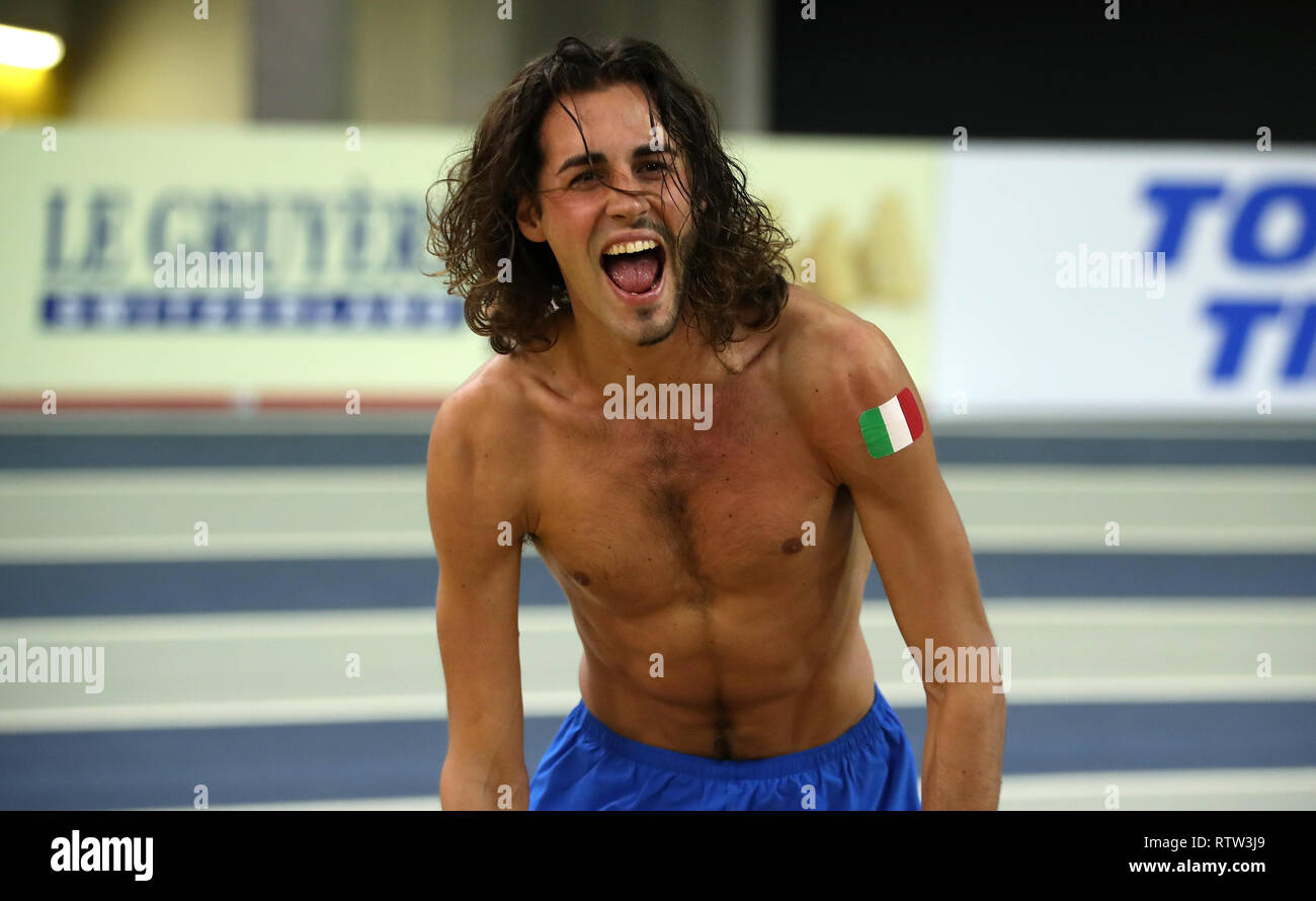 Italy S Gianmarco Tamberi Celebrates Winning Gold In The Men S High Jump During Day Two Of The European Indoor Athletics Championships At The Emirates Arena Glasgow Stock Photo Alamy
