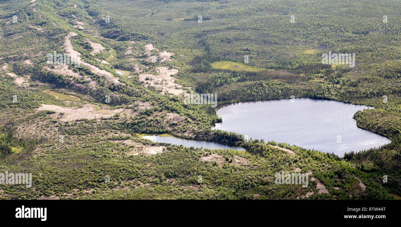 Lakes in northern Manitoba, Canada. An esker, a sandy ridge, formed by during the last Ice Age runs through the landscape. Stock Photo