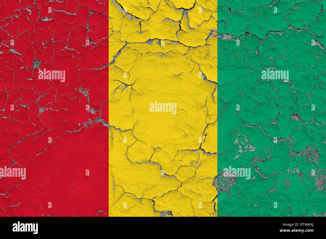 Flag of Guinea painted on cracked dirty wall. National pattern on ...