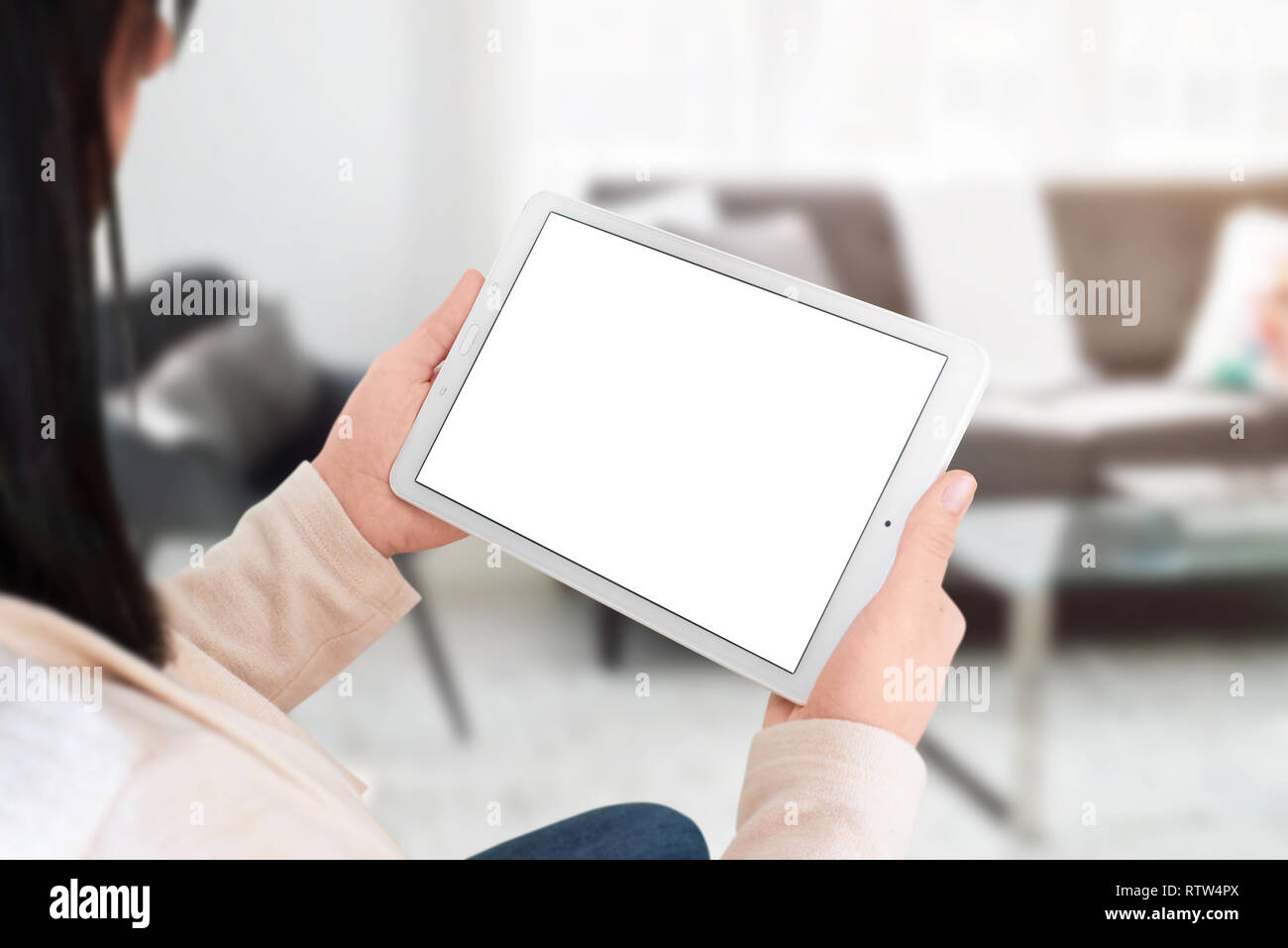 White Tablet Mockup Isolated Screen For App Web Site Presentation Woman Holding Device Living Room Interior In Background Stock Photo Alamy