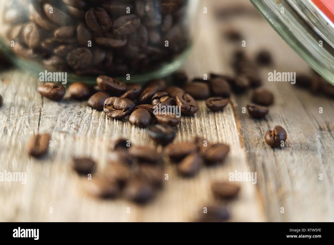 Close-up shot of roasted coffee beans on rustic wooden boards Stock Photo