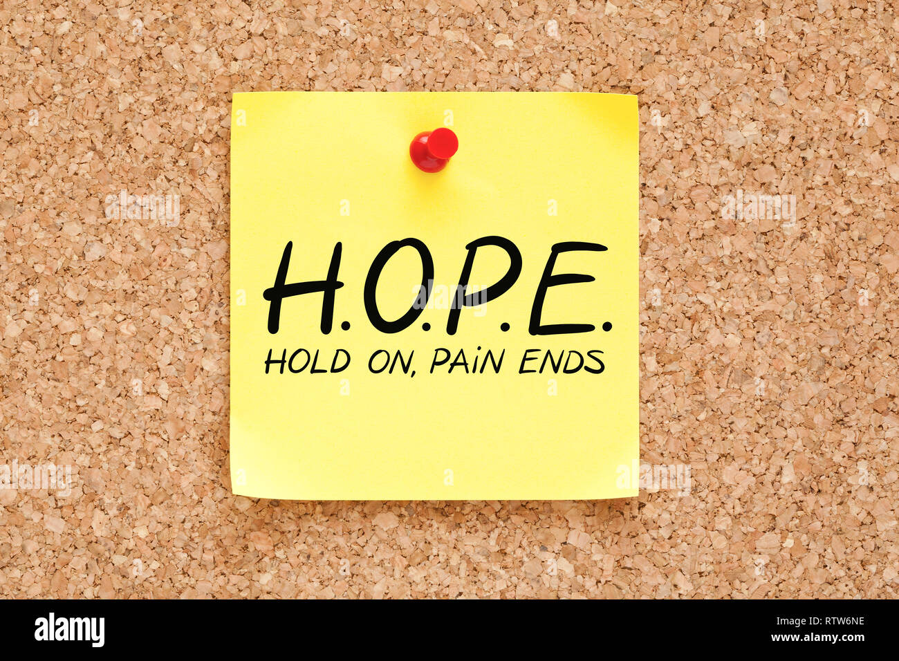 HOPE Hold On Pain Ends concept handwritten on yellow sticky note pinned on bulletin cork board. Stock Photo