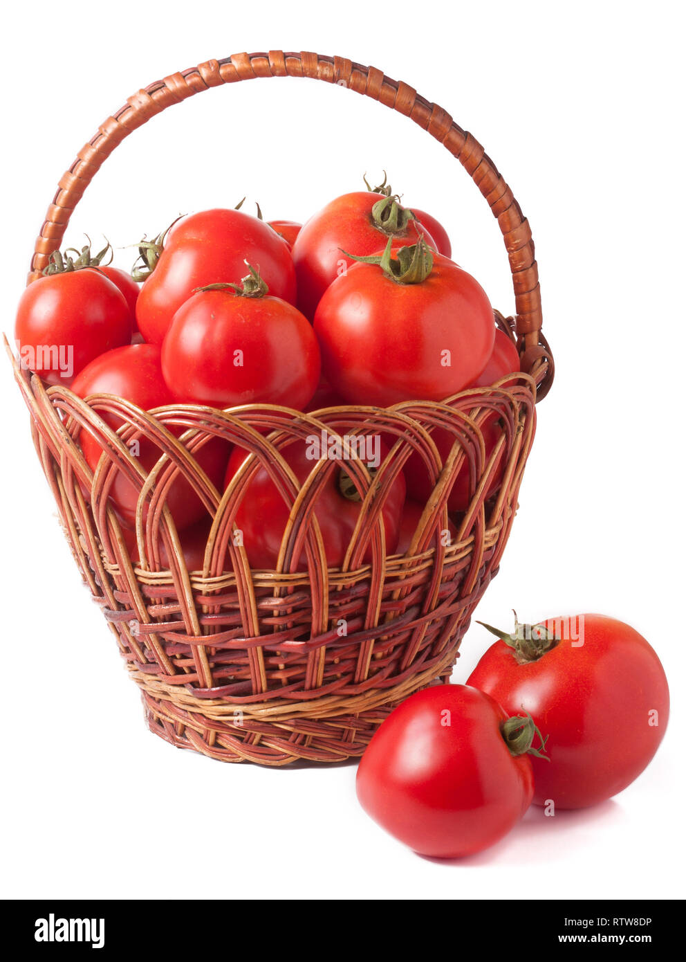 red tomatoes in a wicker basket isolated on white background Stock ...