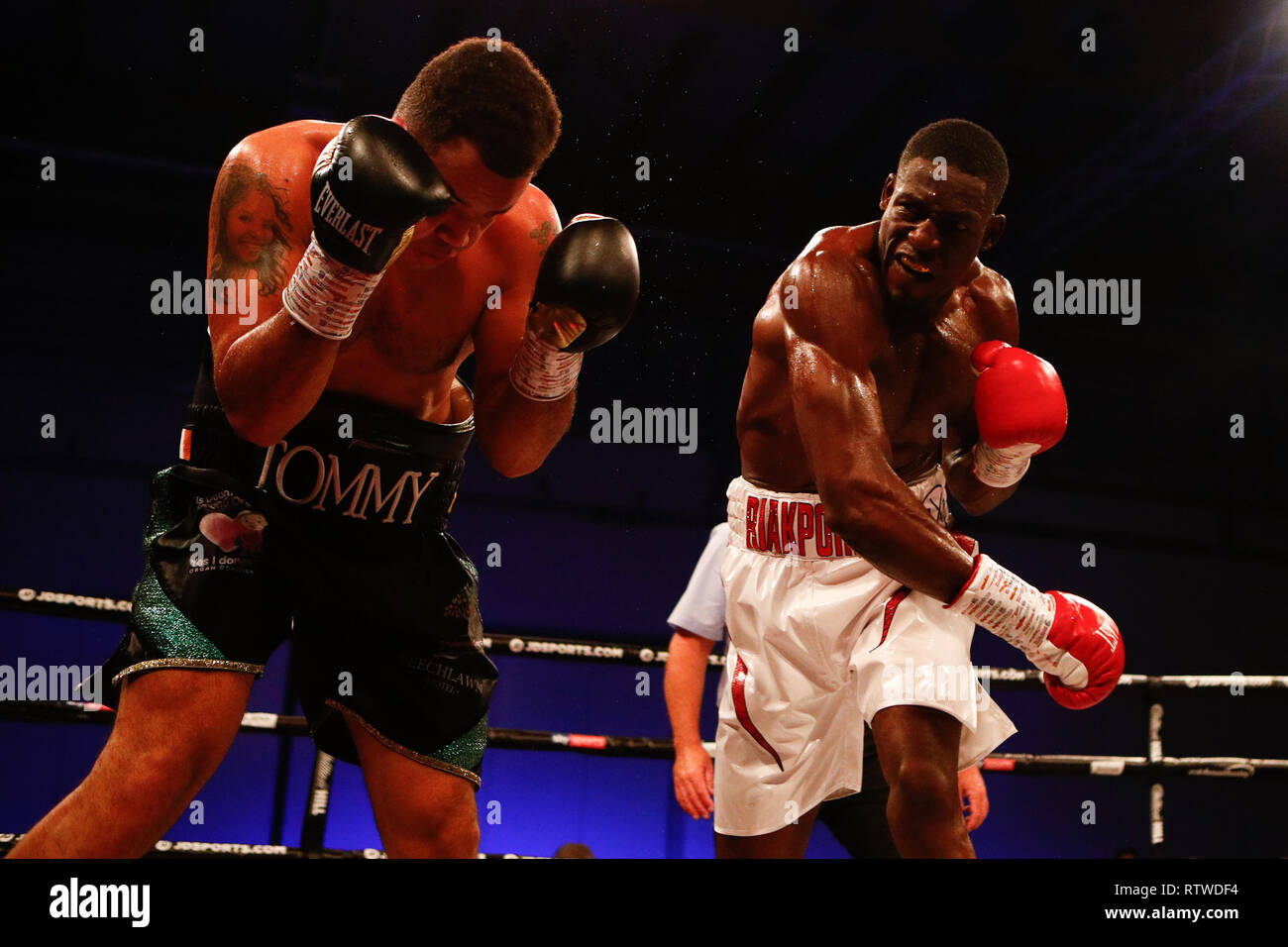 2nd March 2019, East of England Arena, Peterborough, England; Boxing, WBA  International Featherweight Championship, Jordan Gill versus Emmanuel  Dominguez; Undecard fight as Richard Riakporhe (GBR) and Tommy McCarthy  (GBR) trade punches during