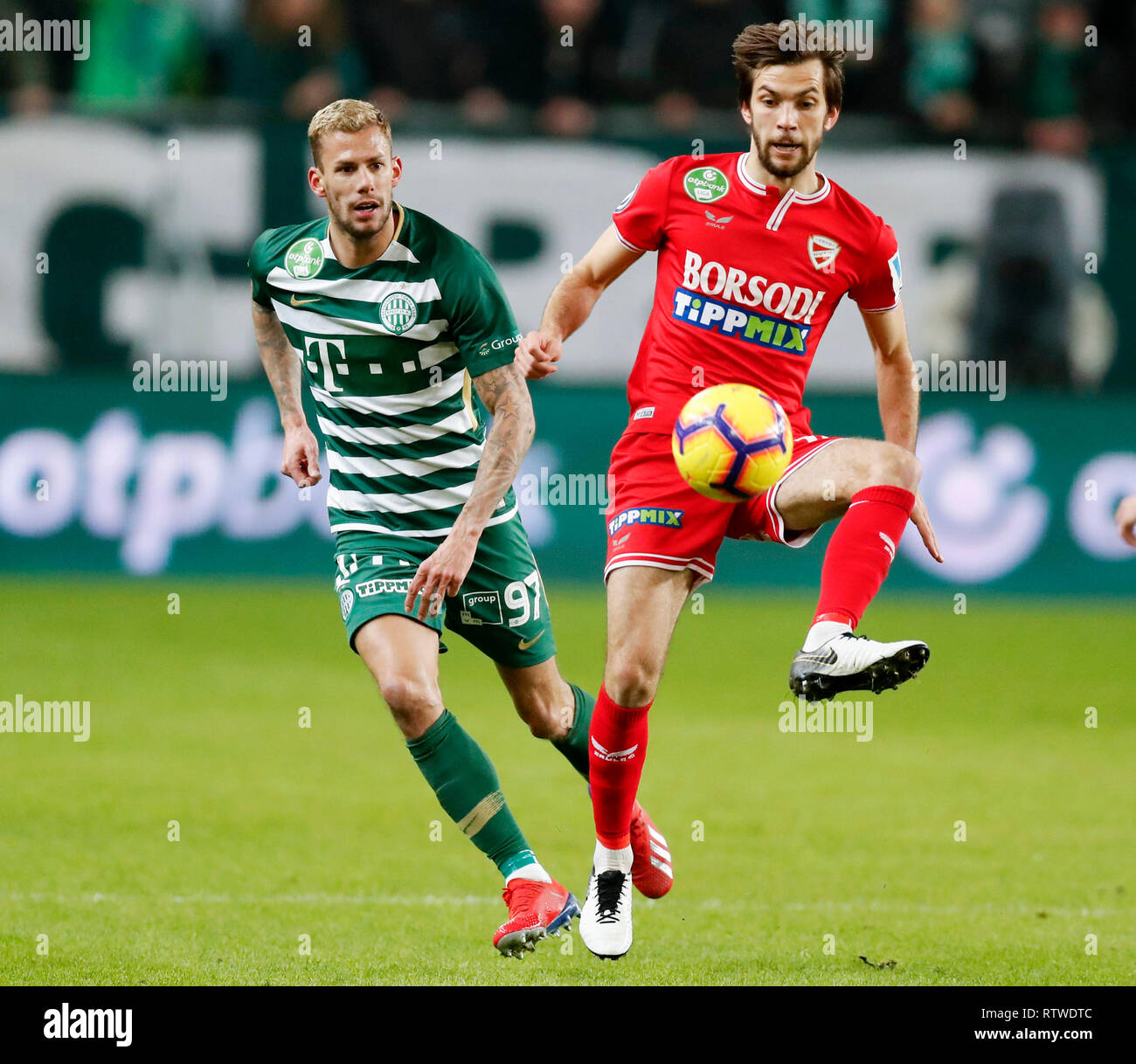 BUDAPEST, HUNGARY - MARCH 2: (r-l) David Markvart of DVTK controls the ball  next to Roland Varga of Ferencvarosi TC during the Hungarian OTP Bank Liga  match between Ferencvarosi TC and DVTK