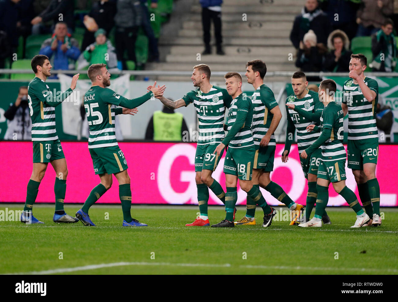 BUDAPEST, HUNGARY - JULY 12: (r-l) Roland Varga of Ferencvarosi TC hugs  goal scorer Stefan