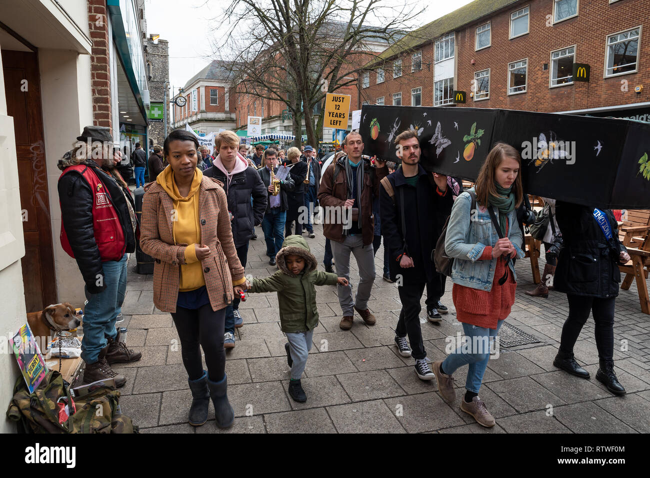 Canterbury, UK. 23rd February 2019. Supporters of the Canterbury Extinction Rebellion Group form up in the City Centre then take part in a symbolic funeral procession representing the death of plants, animals, humans and the planet due to the climate crisis, loss or life. The protest culminated in a swarming action blocking St. Peters Place. Police were present but didn't interfere, there were no arrests. Credit: Stephen Bell/Alamy Live News Stock Photo