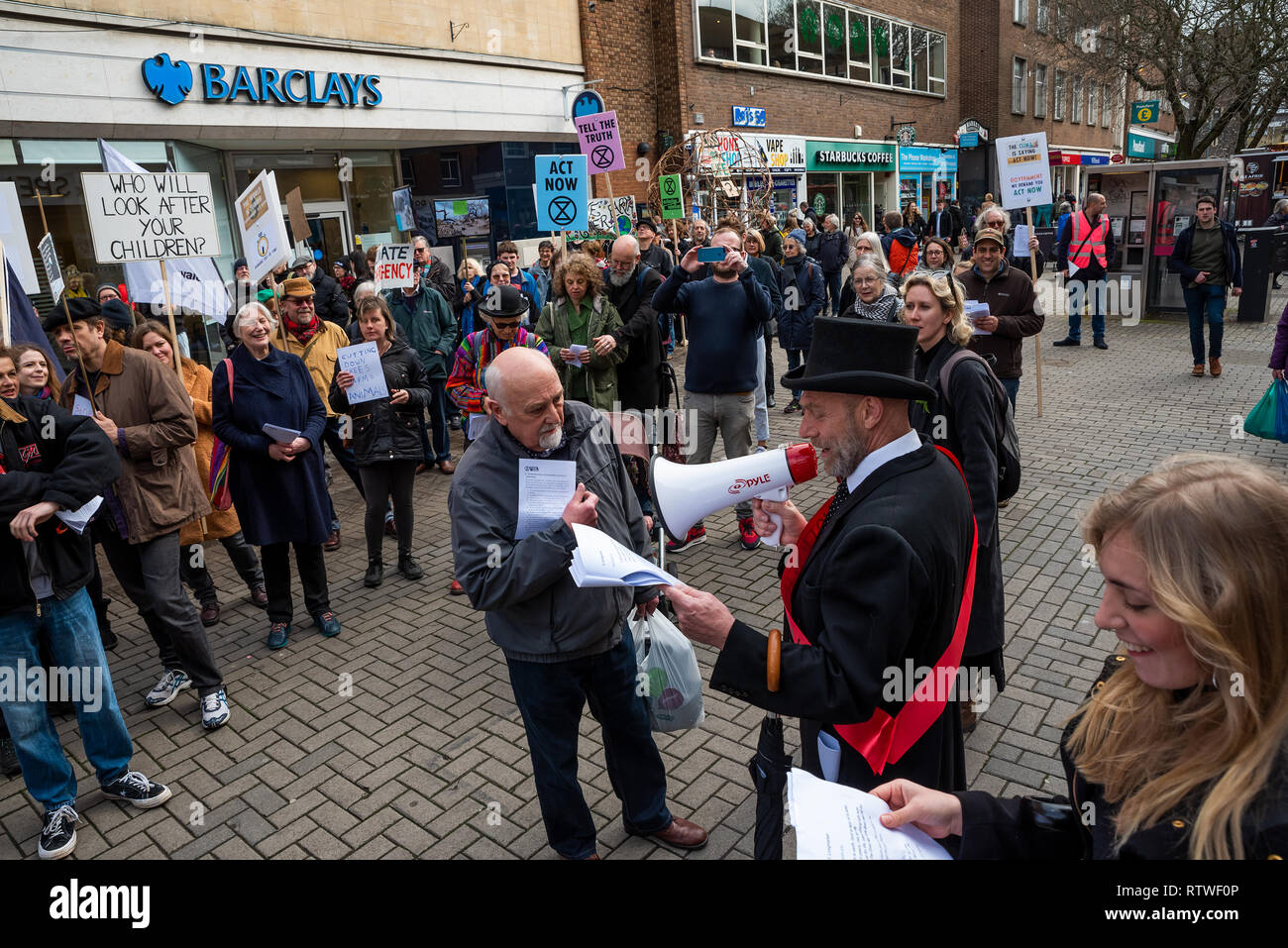 Canterbury, UK. 23rd February 2019. Supporters of the Canterbury Extinction Rebellion Group form up in the City Centre then take part in a symbolic funeral procession representing the death of plants, animals, humans and the planet due to the climate crisis, loss or life. The protest culminated in a swarming action blocking St. Peters Place. Police were present but didn't interfere, there were no arrests. Credit: Stephen Bell/Alamy Live News Stock Photo