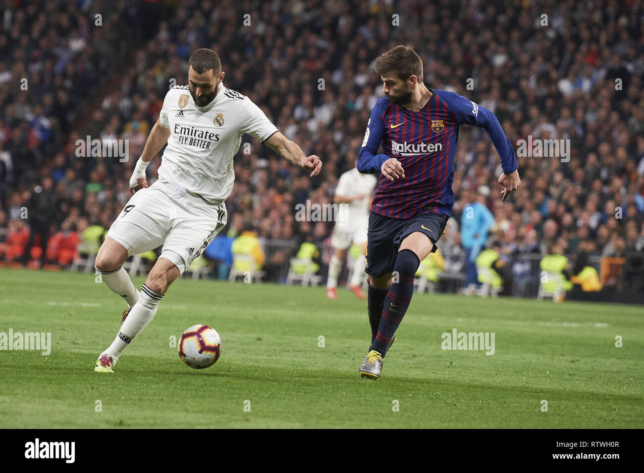 Madrid, Madrid, Spain. 2nd Mar, 2019. Karim Benzema (forward; Real Madrid), Gerard Pique (defender; Barcelona) in action during La Liga match between Real Madrid and FC Barcelona at Santiago Bernabeu Stadium on March 3, 2019 in Madrid, Spain Credit: Jack Abuin/ZUMA Wire/Alamy Live News Stock Photo