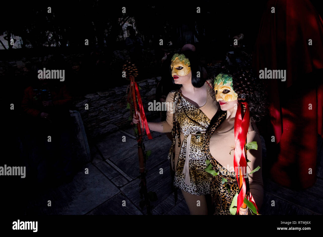 Women are seen dressed up during the Falliforia or Fallagogia, an ancient Greek festival honoring the god Dionysus with orgiastic character. Stock Photo