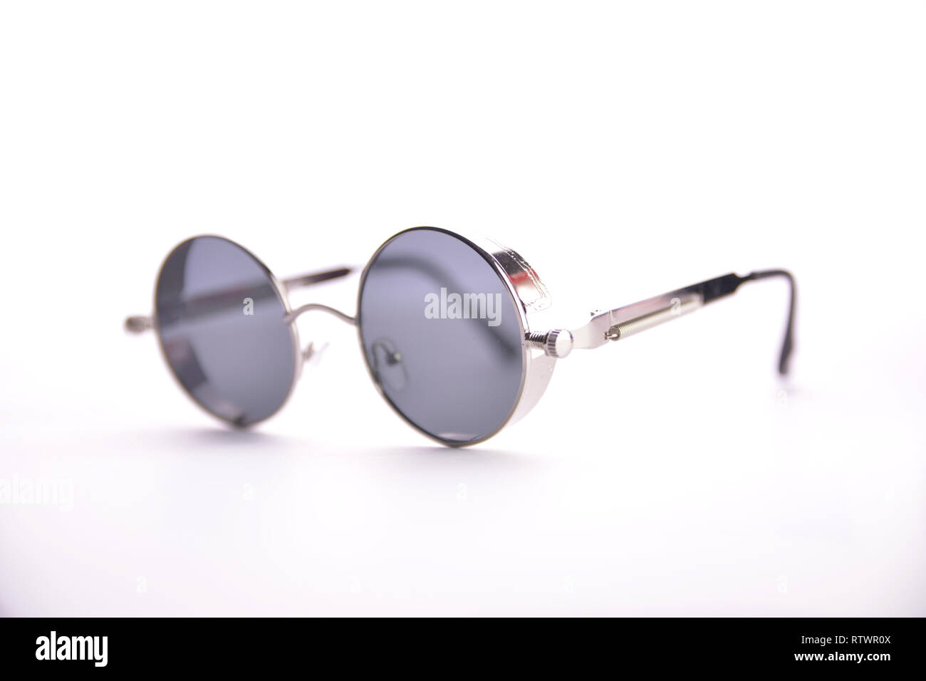 fashionable glasses in the style of steampunk on a white background. Stock Photo