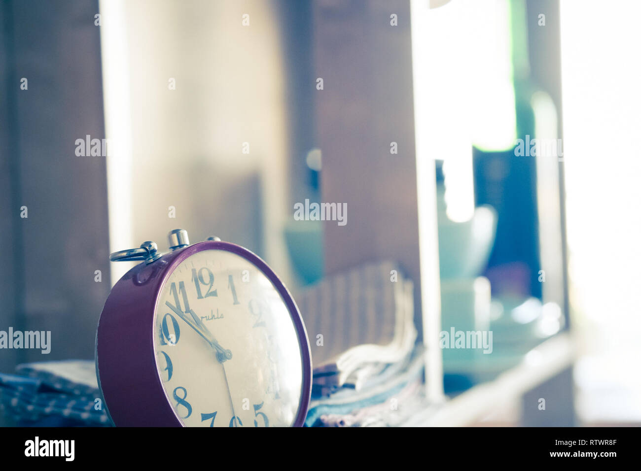 Vintage alarm clock on the shelf with dishes Stock Photo Alamy
