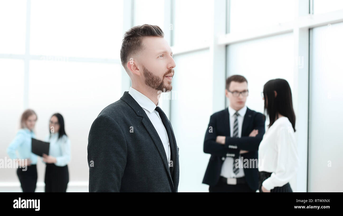 pensive business man looking through office window Stock Photo
