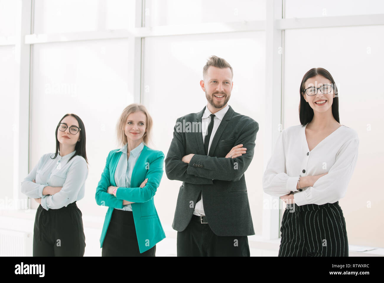 professional business team standing near the office window Stock Photo ...