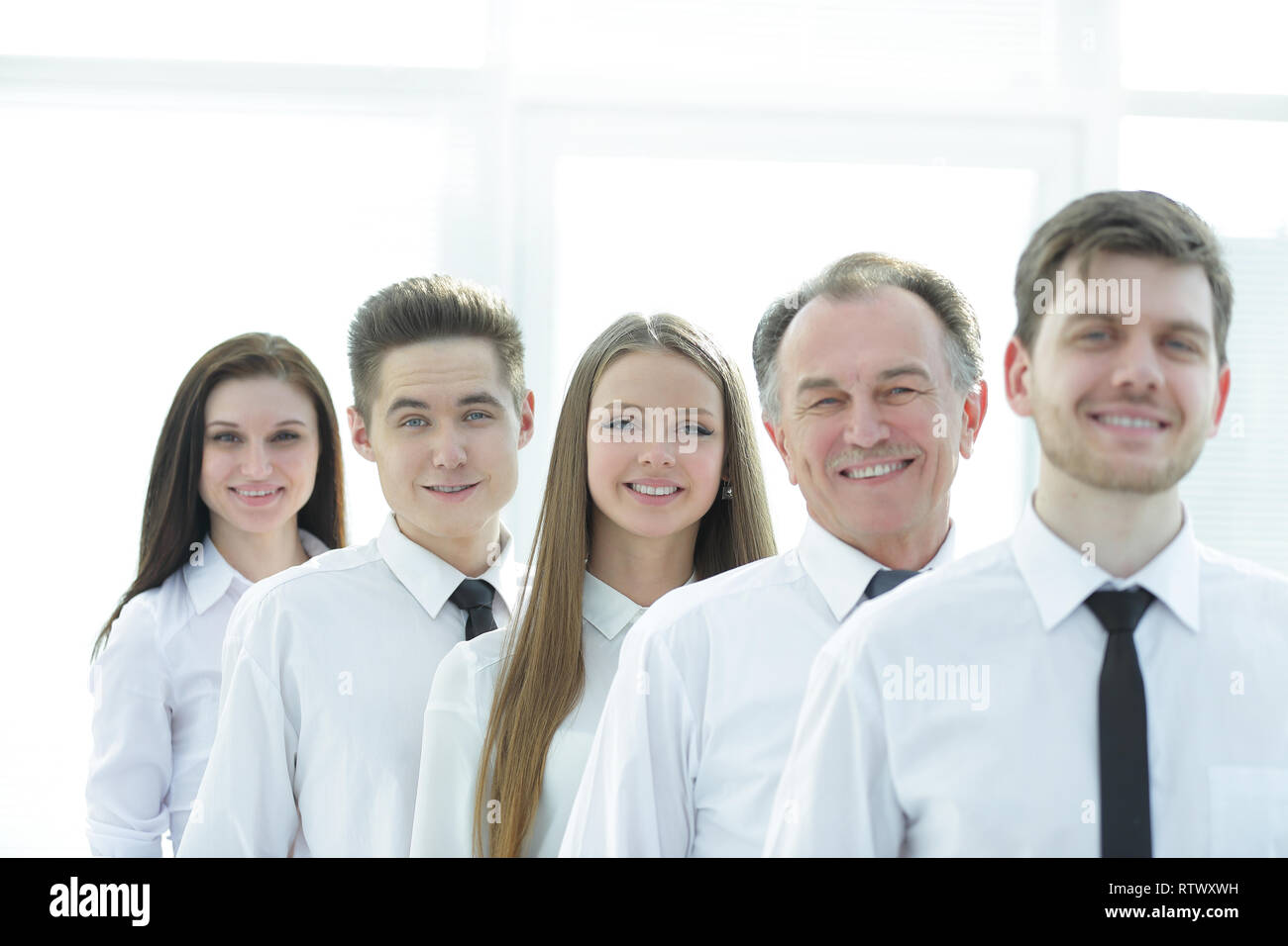 close up. a successful group of employees standing in a row Stock Photo ...