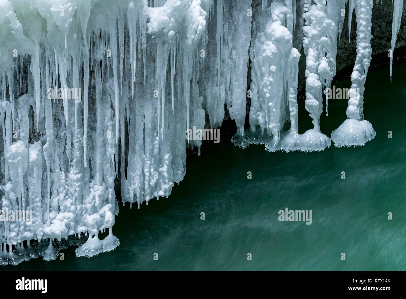 Icicles over running water, Partnach Gorge, Upper Bavaria, Germany Stock Photo
